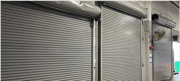 Completed gray roll-up doors with a uniform finish